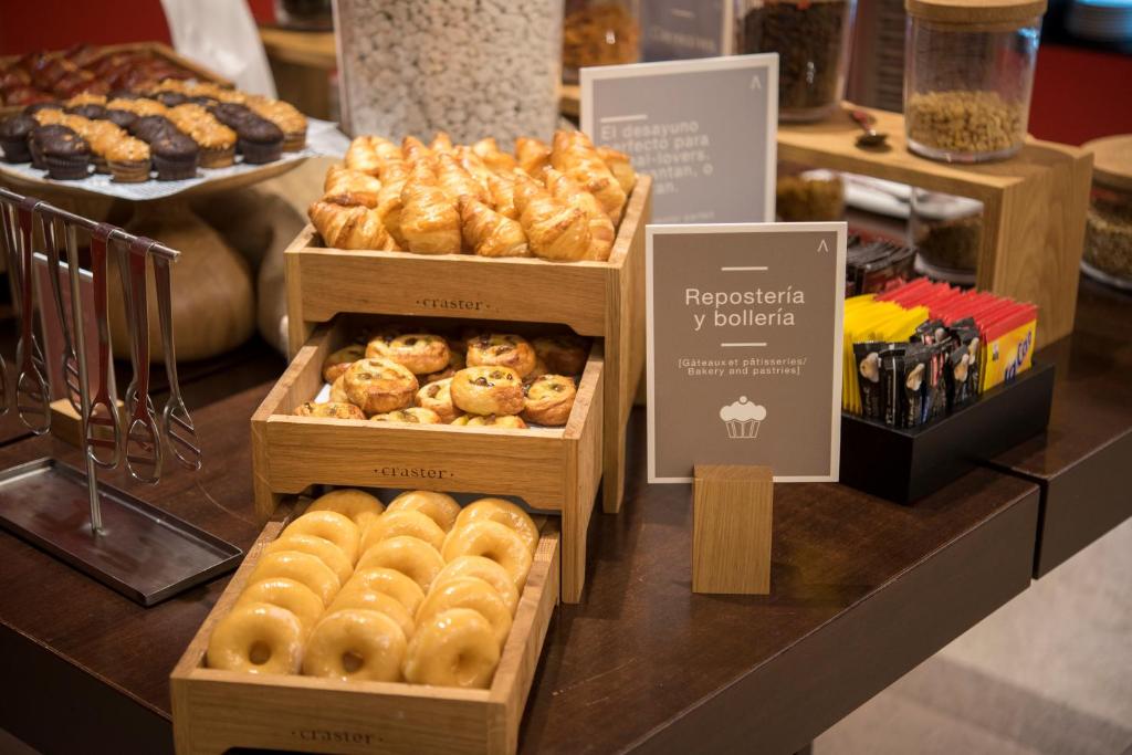 four boxes of pastries on a counter in a bakery at Barceló Costa Vasca in San Sebastián