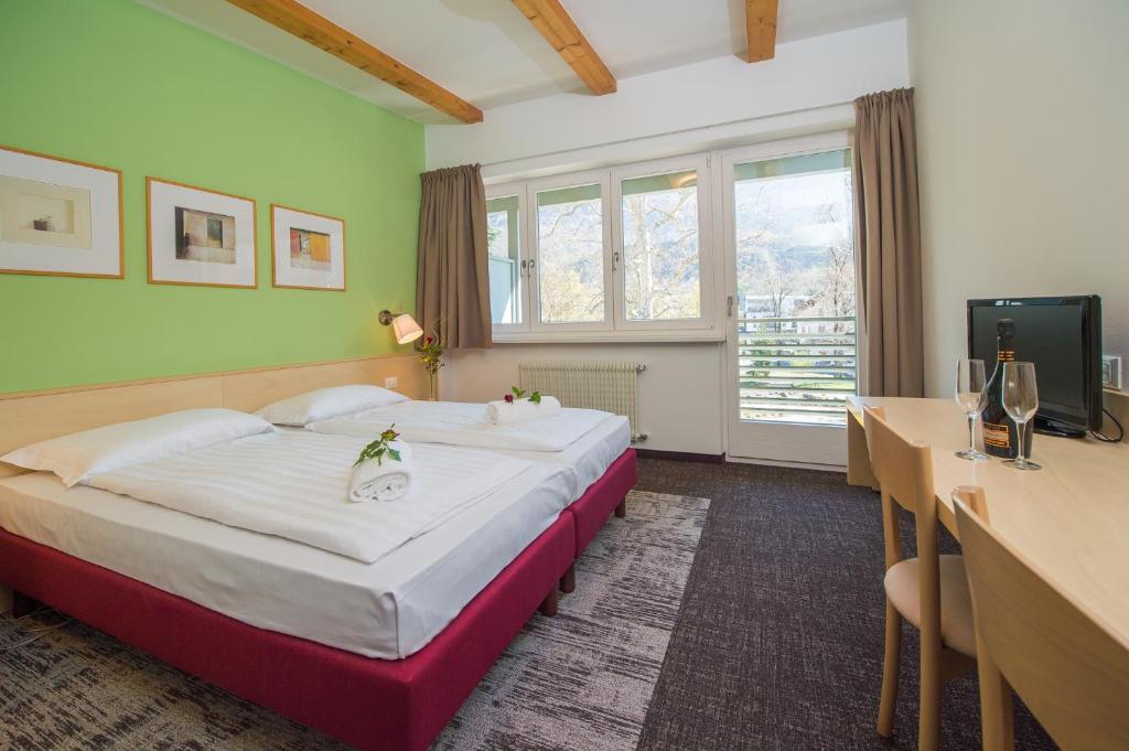 Postel nebo postele na pokoji v ubytování Hotel Heide Park