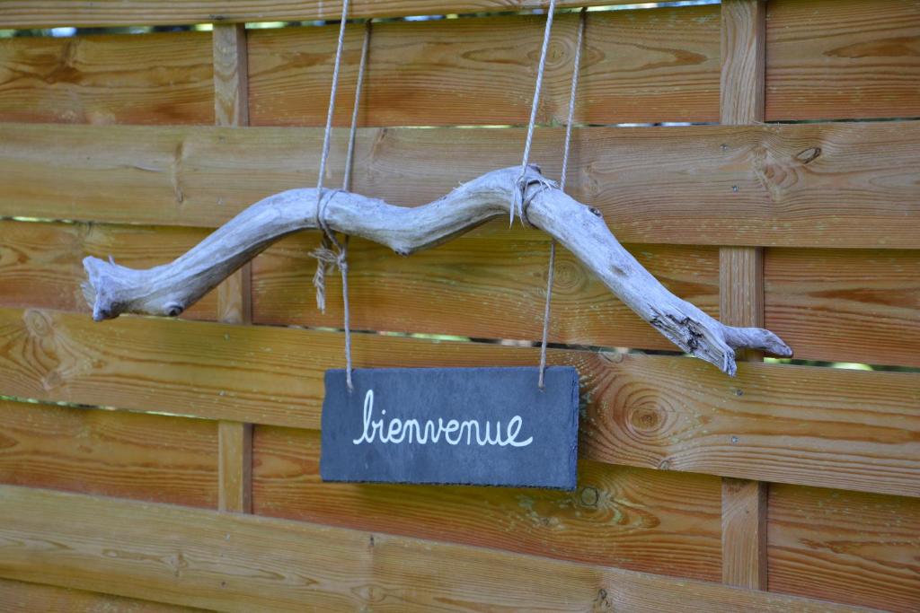 a sign that says hermite hanging on a wood wall at Le Mas de Panier in Caderousse