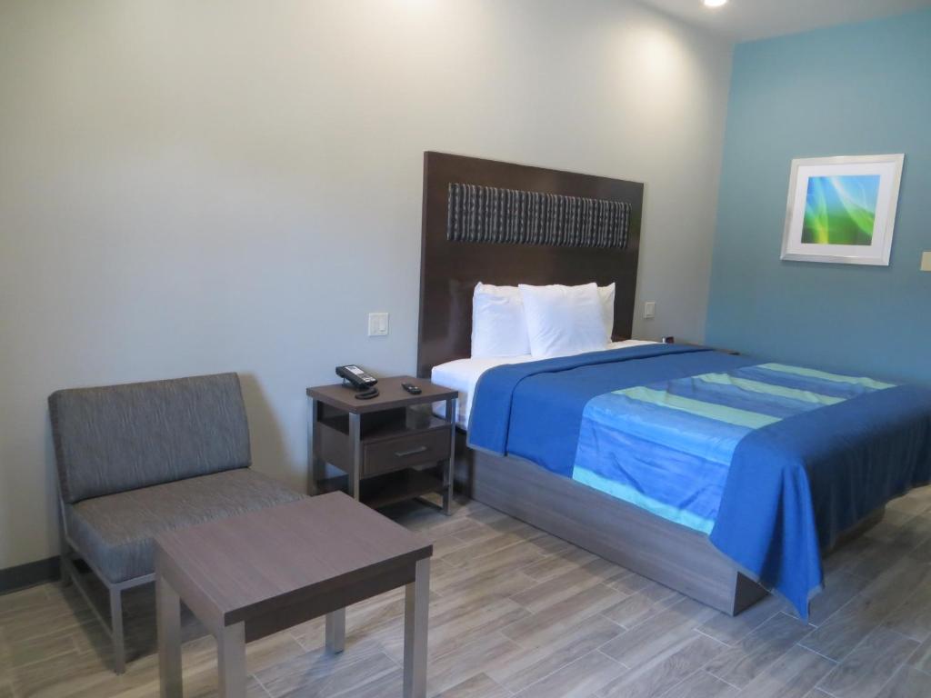 Voodi või voodid majutusasutuse Hotel Blue - Woodlands toas