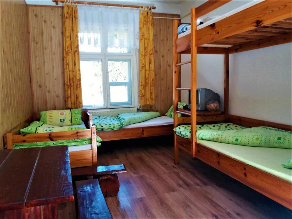 Posteľ alebo postele v izbe v ubytovaní Zbójnicki Ostęp