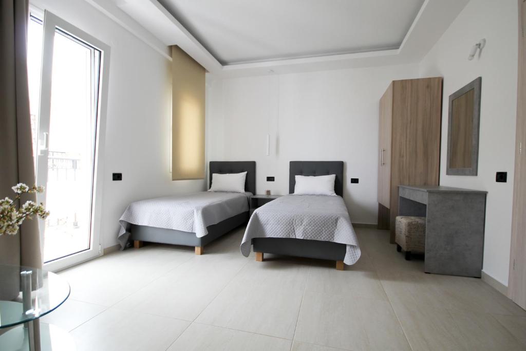 Postel nebo postele na pokoji v ubytování Xenia Stalis Apartments
