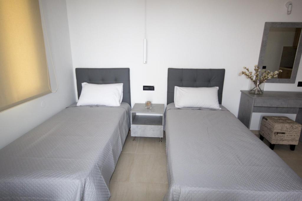 Postel nebo postele na pokoji v ubytování Xenia Stalis Apartments