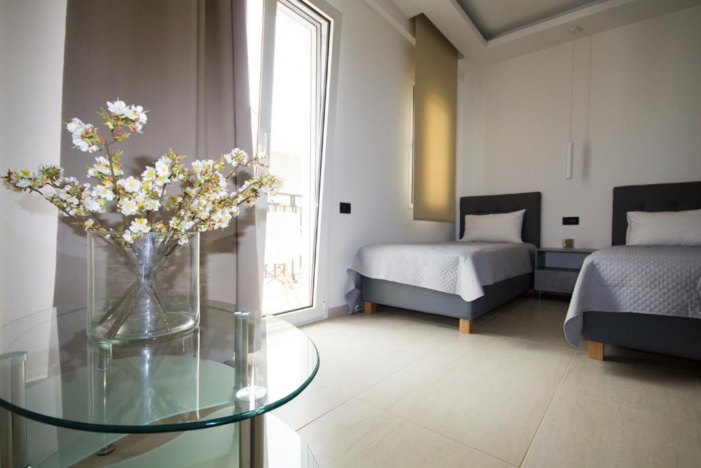 Postel nebo postele na pokoji v ubytování Xenia Stalis Apartments