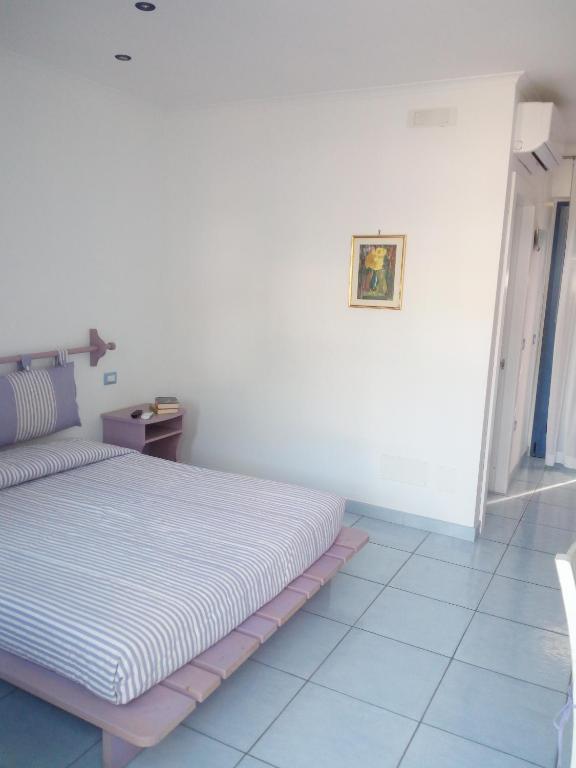 Postel nebo postele na pokoji v ubytování B&B Conca del Faro