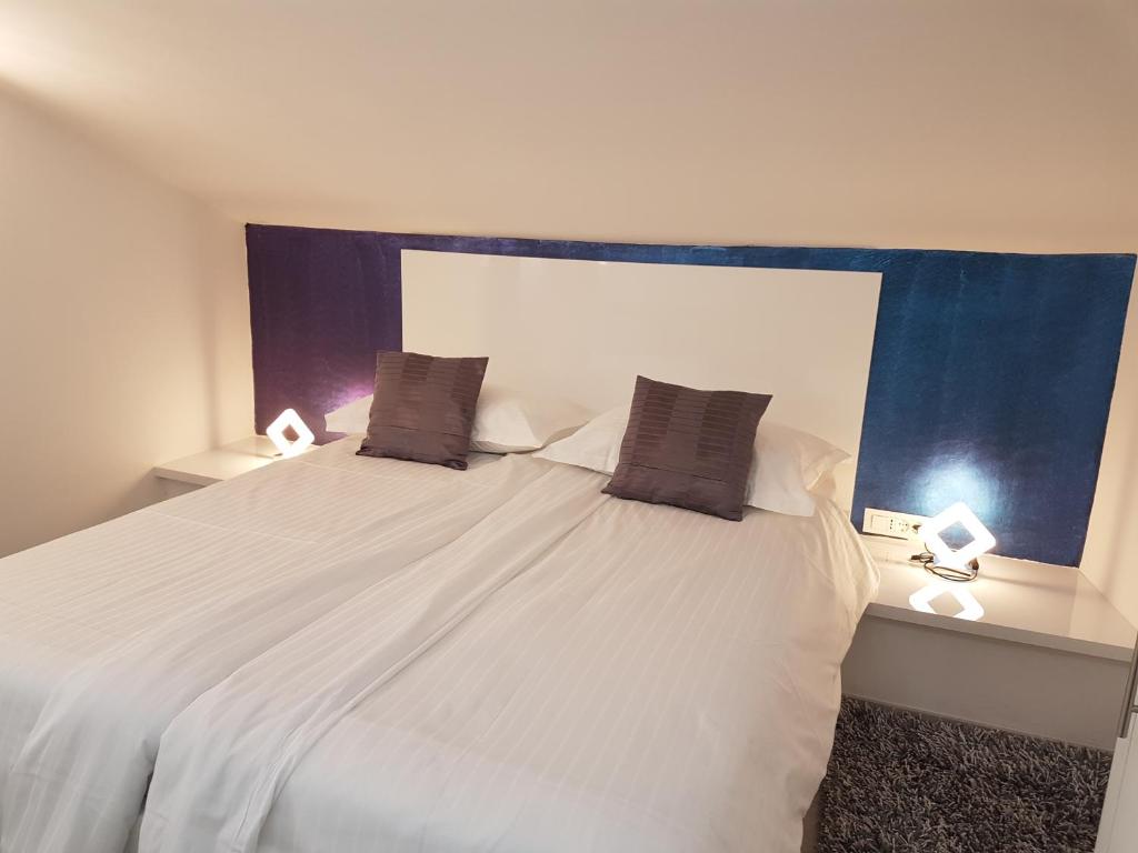 Posteľ alebo postele v izbe v ubytovaní Palladium City Center Apartments