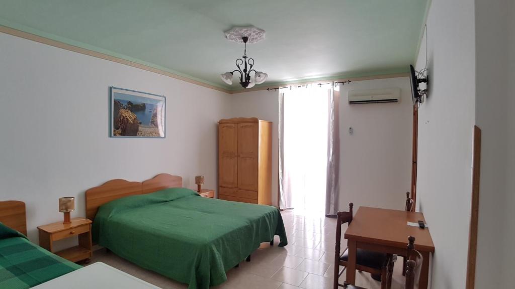 Postel nebo postele na pokoji v ubytování Casa Vittorio B&b