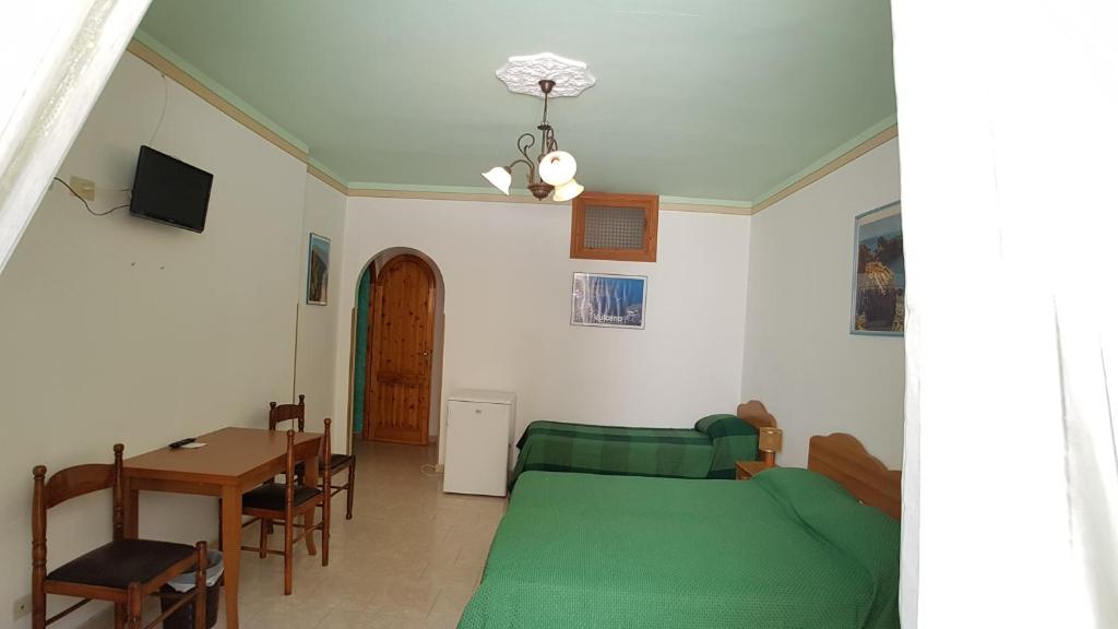 TV a/nebo společenská místnost v ubytování Casa Vittorio B&b