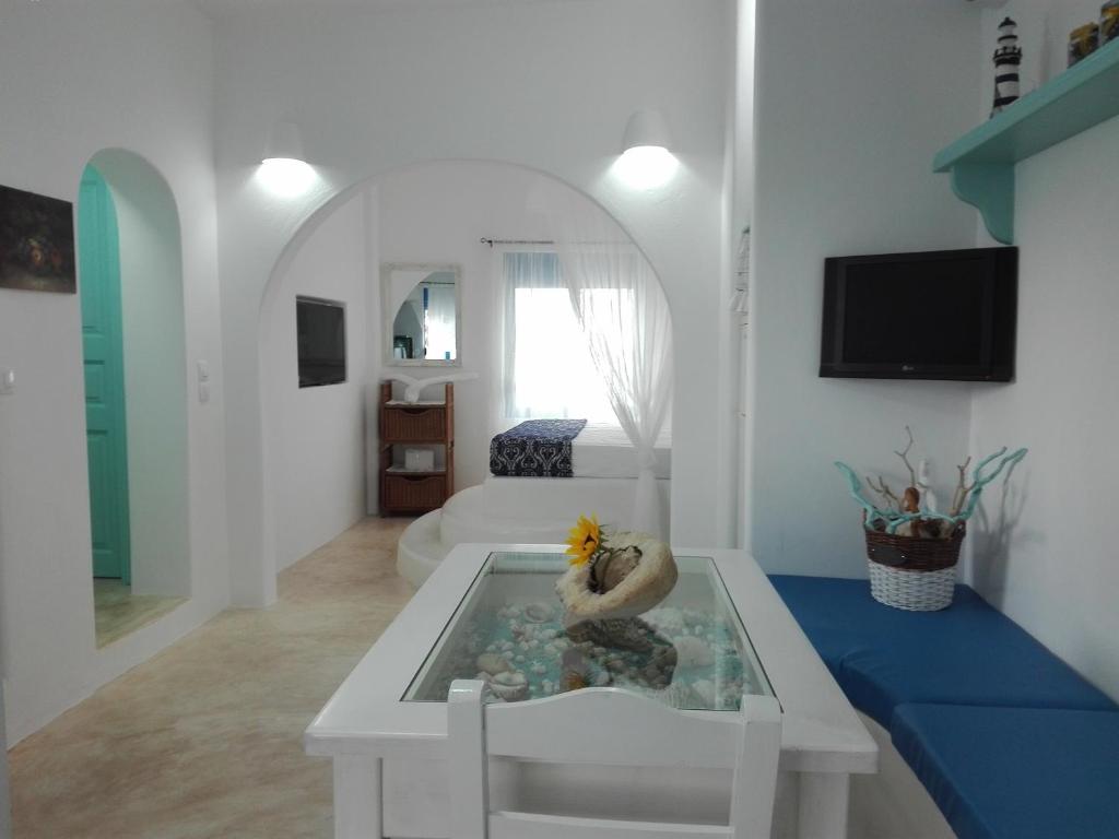 a living room with a table with a fish in it at Tilos Island house in Megálon Choríon