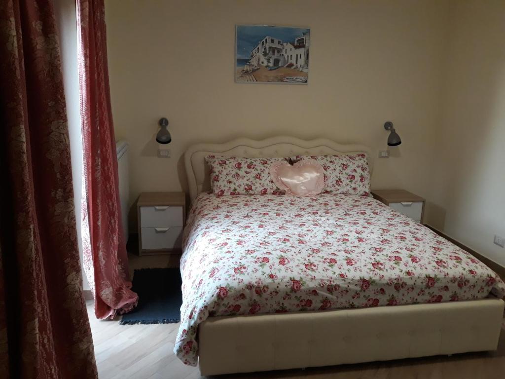 Postel nebo postele na pokoji v ubytování La Camelia B&B