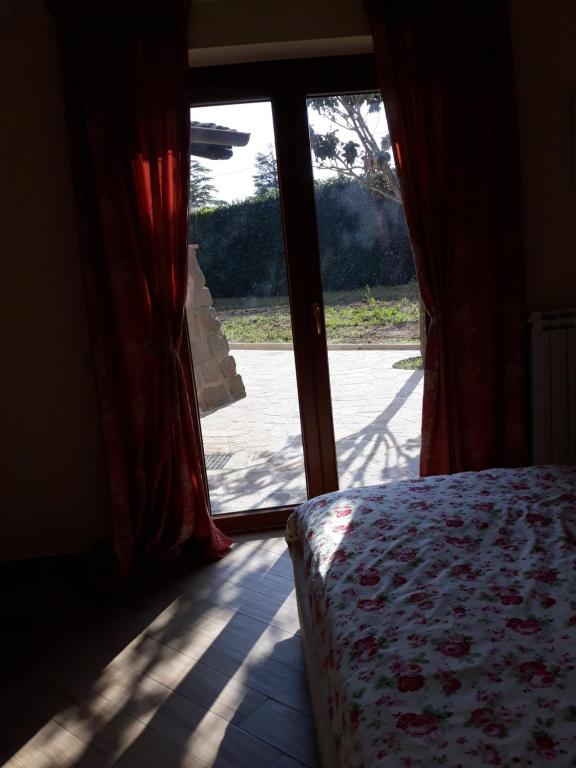 Postel nebo postele na pokoji v ubytování La Camelia B&B