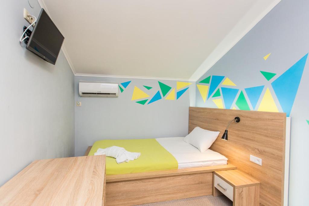 Ліжко або ліжка в номері Blum Hotel
