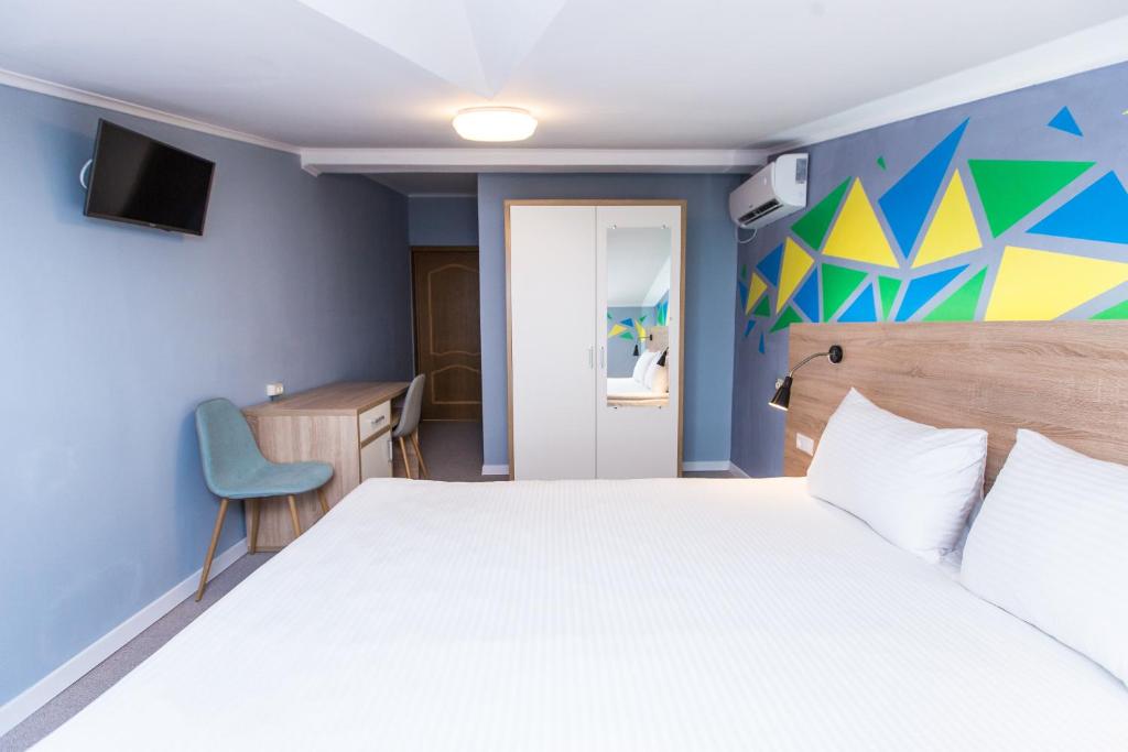 Ліжко або ліжка в номері Blum Hotel