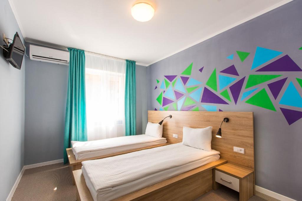 Ліжко або ліжка в номері Blum Hotel