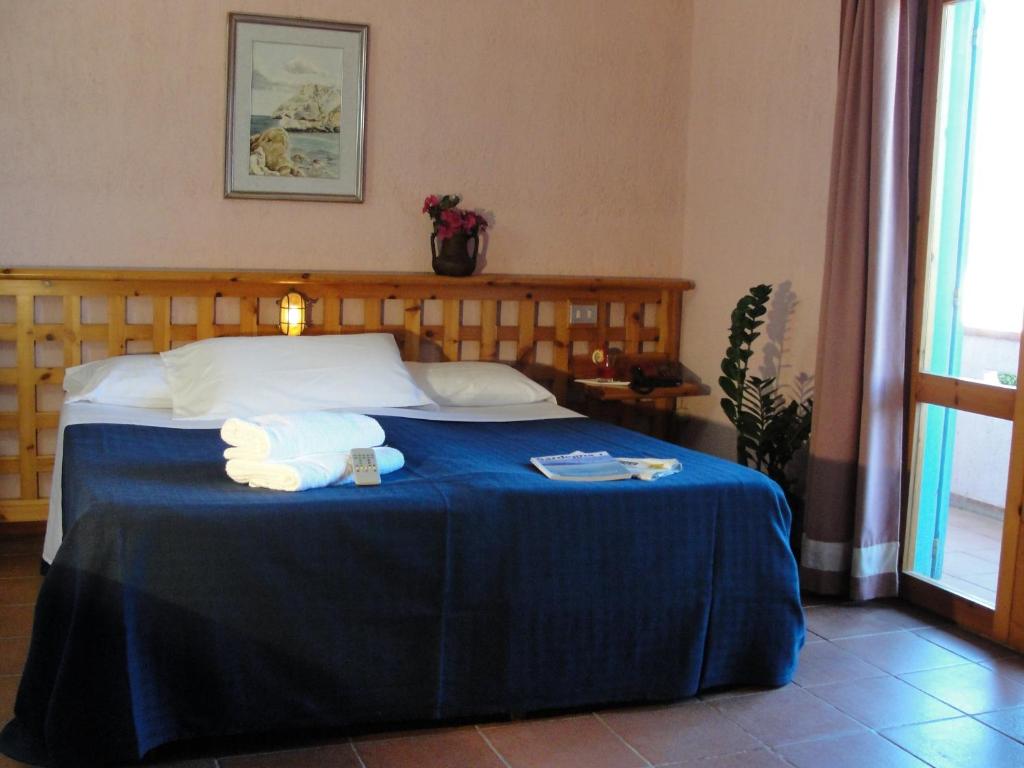 Postel nebo postele na pokoji v ubytování Hotel Scintilla