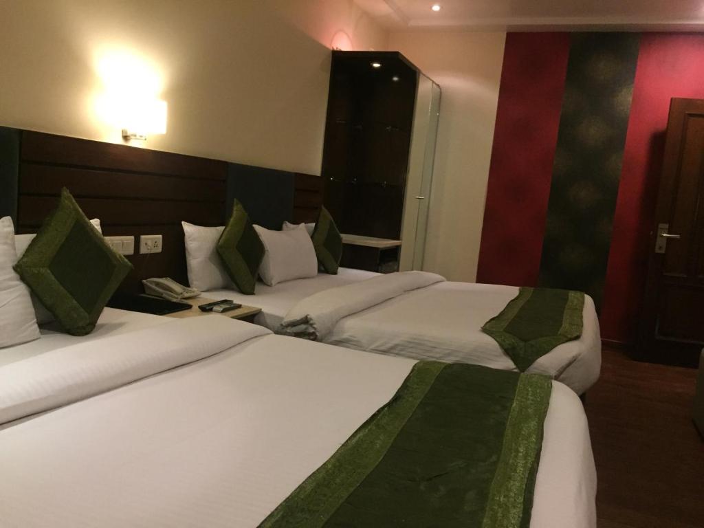 Postel nebo postele na pokoji v ubytování Hotel Aura - New Delhi Railway Station