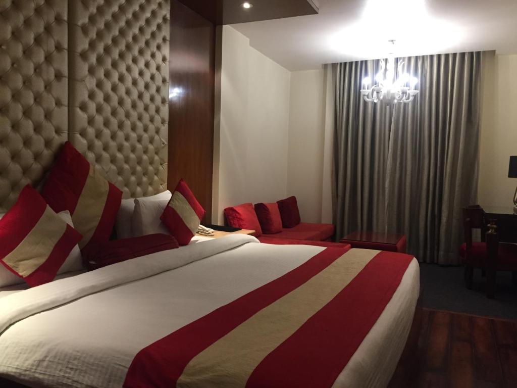 Postel nebo postele na pokoji v ubytování Hotel Aura - New Delhi Railway Station