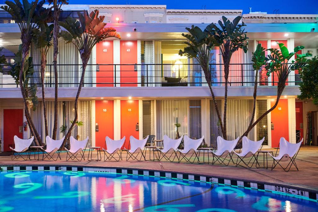 a hotel with chairs and a swimming pool at Phoenix Hotel in San Francisco