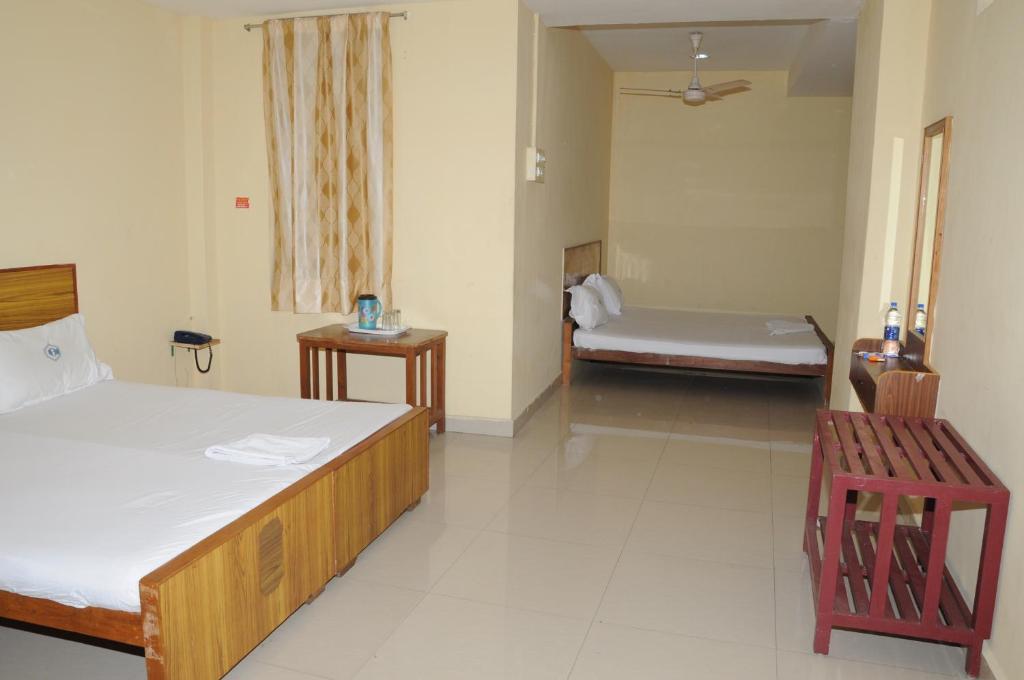 Postel nebo postele na pokoji v ubytování Hotel Chanma International