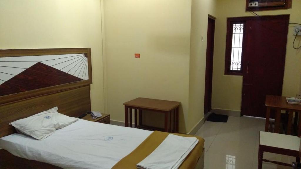 Postel nebo postele na pokoji v ubytování Hotel Chanma International