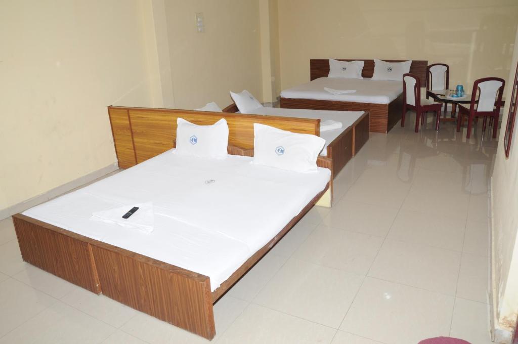 Postel nebo postele na pokoji v ubytování Hotel Chanma International