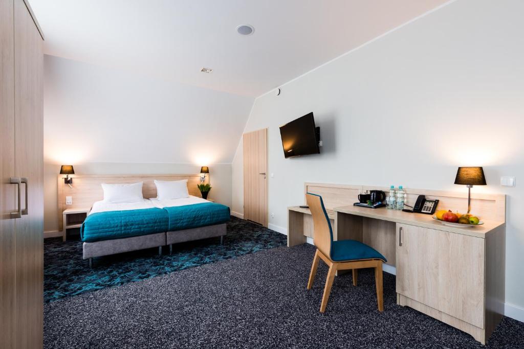 Postel nebo postele na pokoji v ubytování Hotel Eureka