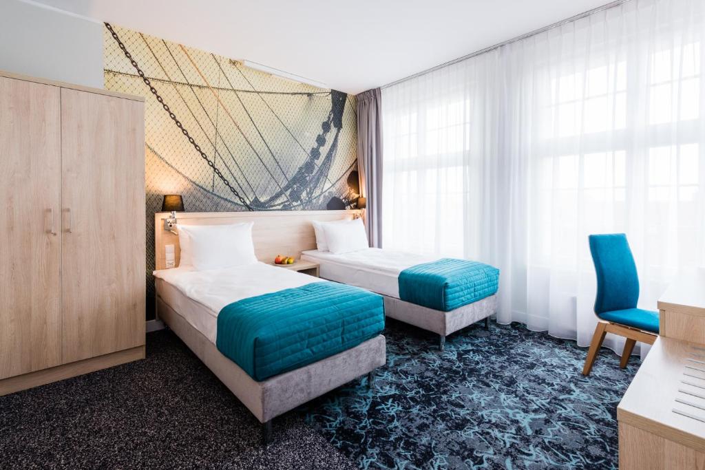 Postel nebo postele na pokoji v ubytování Hotel Eureka