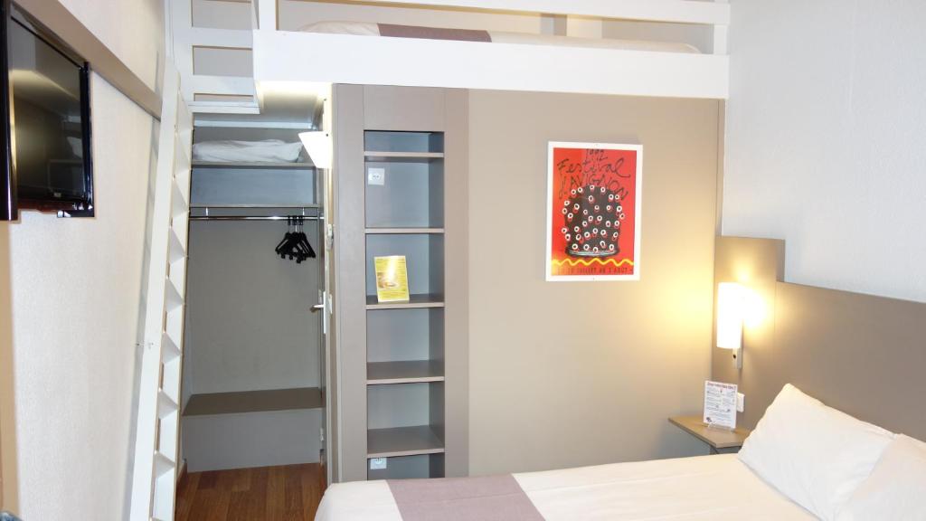 Postel nebo postele na pokoji v ubytování Hotel Cristol