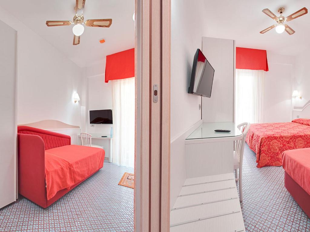 Postel nebo postele na pokoji v ubytování Hotel Caravelle