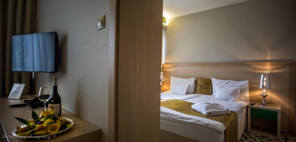 Postel nebo postele na pokoji v ubytování Hotel Aurum Family "A"