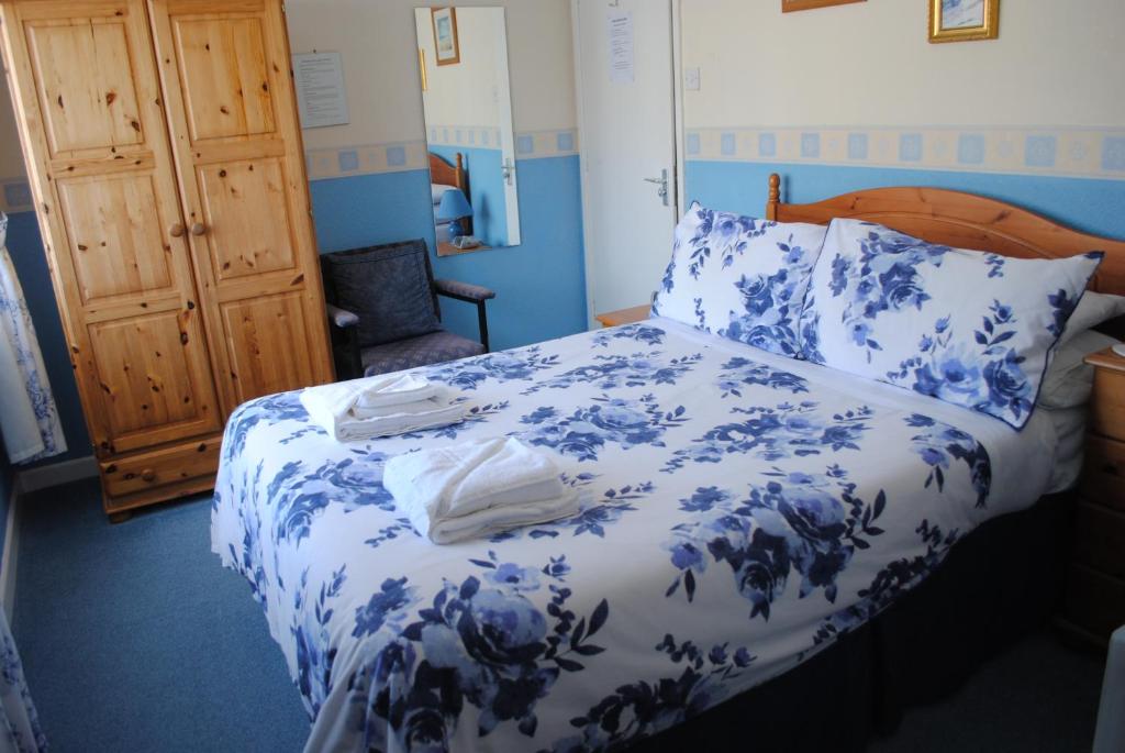 Postel nebo postele na pokoji v ubytování Craig-Ard Hotel