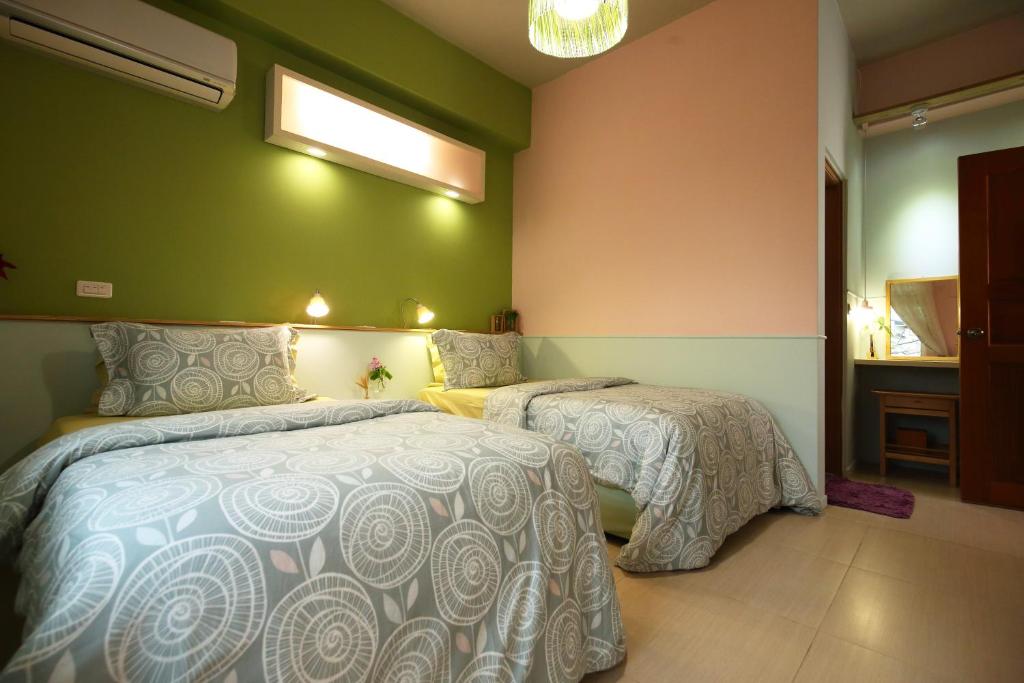 Postel nebo postele na pokoji v ubytování Huxi B&B