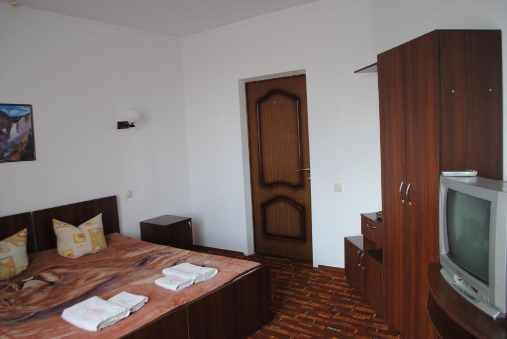 Postel nebo postele na pokoji v ubytování Hotel - restaurant "Lion's heart"