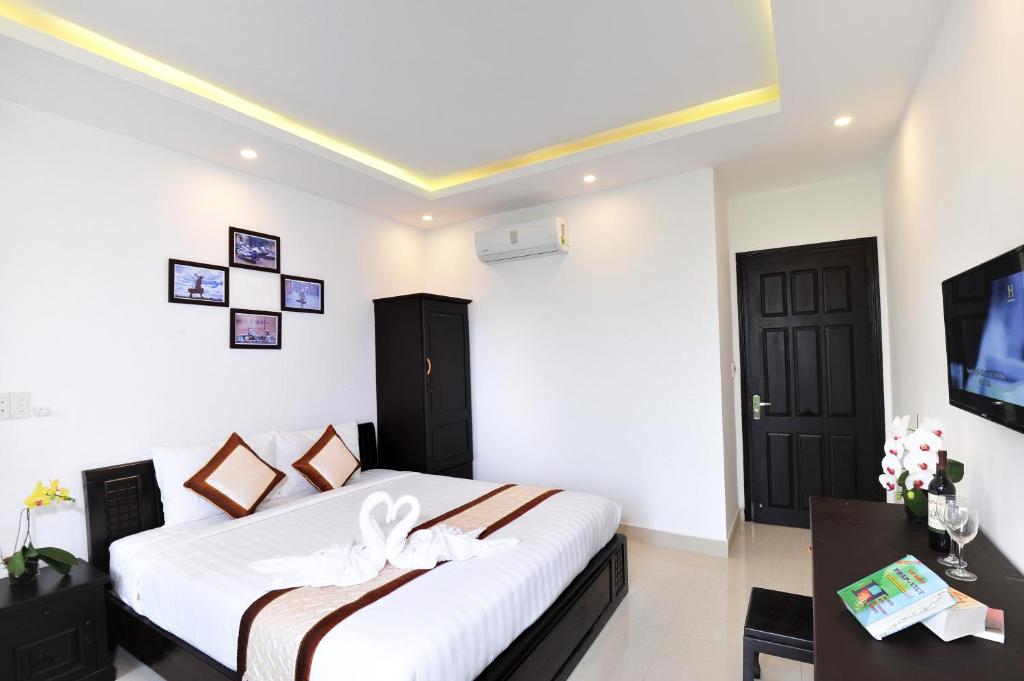 Postel nebo postele na pokoji v ubytování Hoi An Bali Homestay