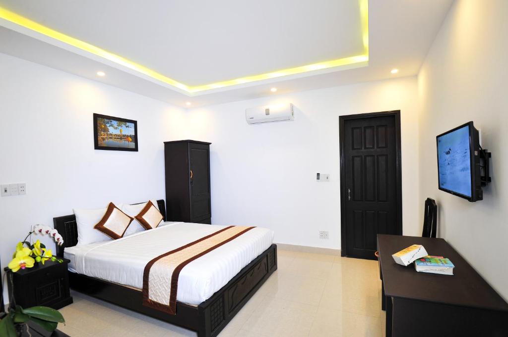 Postel nebo postele na pokoji v ubytování Hoi An Bali Homestay