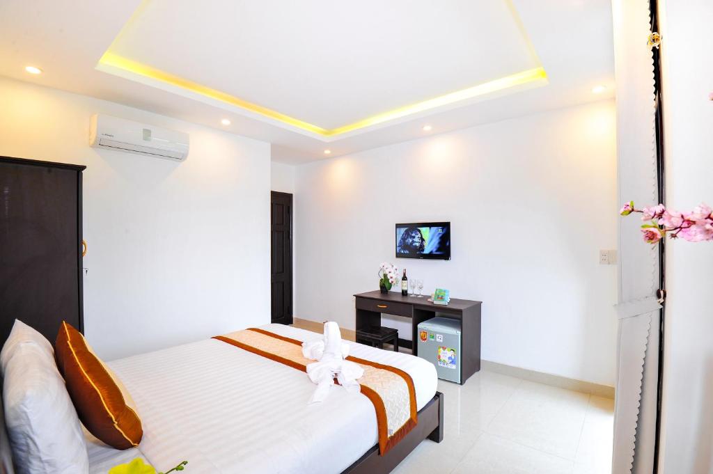 Postel nebo postele na pokoji v ubytování Hoi An Bali Homestay