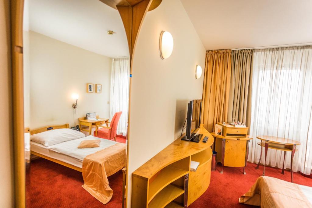 Postel nebo postele na pokoji v ubytování Hotel SET
