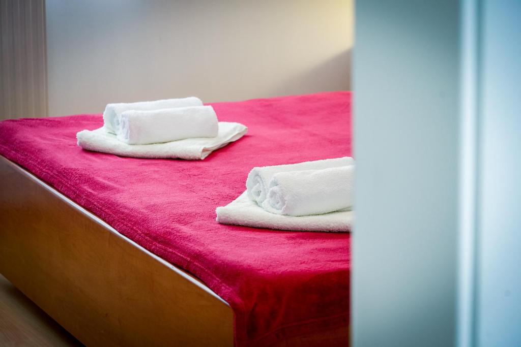 Posteľ alebo postele v izbe v ubytovaní Apartments L&L