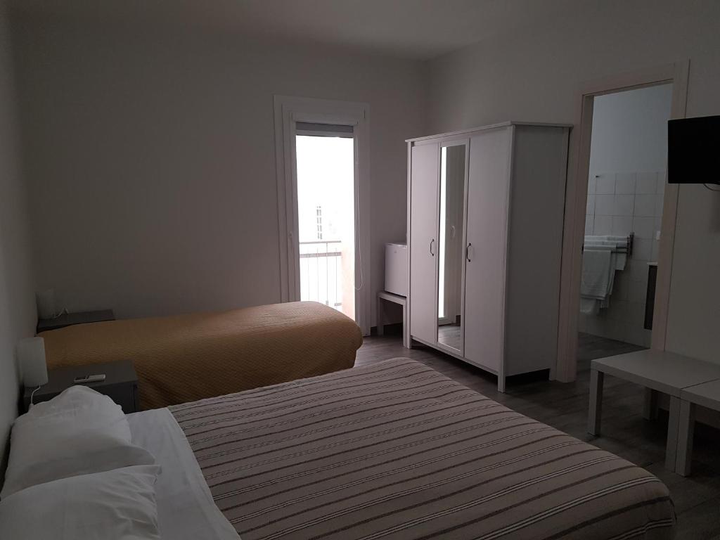 Postel nebo postele na pokoji v ubytování Beda Ragusa