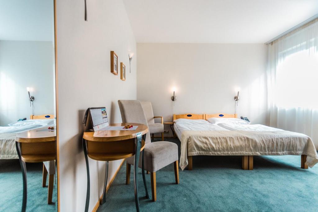 Postel nebo postele na pokoji v ubytování Hotel SET