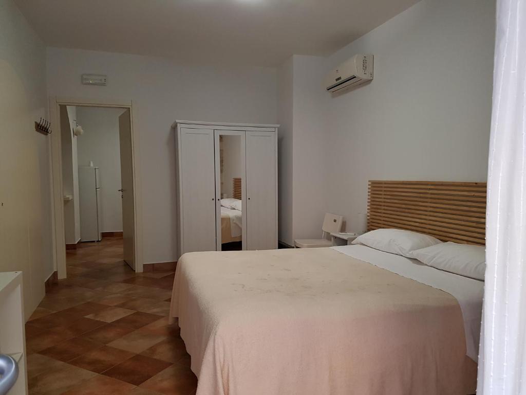 Łóżko lub łóżka w pokoju w obiekcie Iblea Paradise