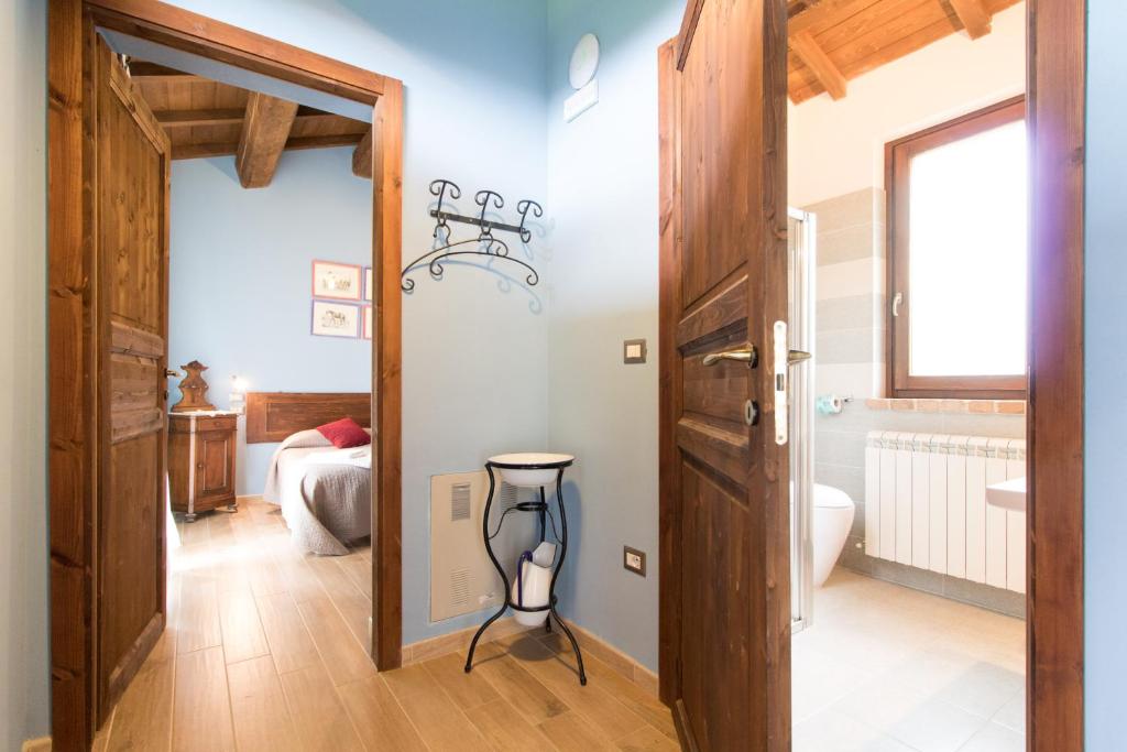 Postel nebo postele na pokoji v ubytování Fattoria Il Bruco