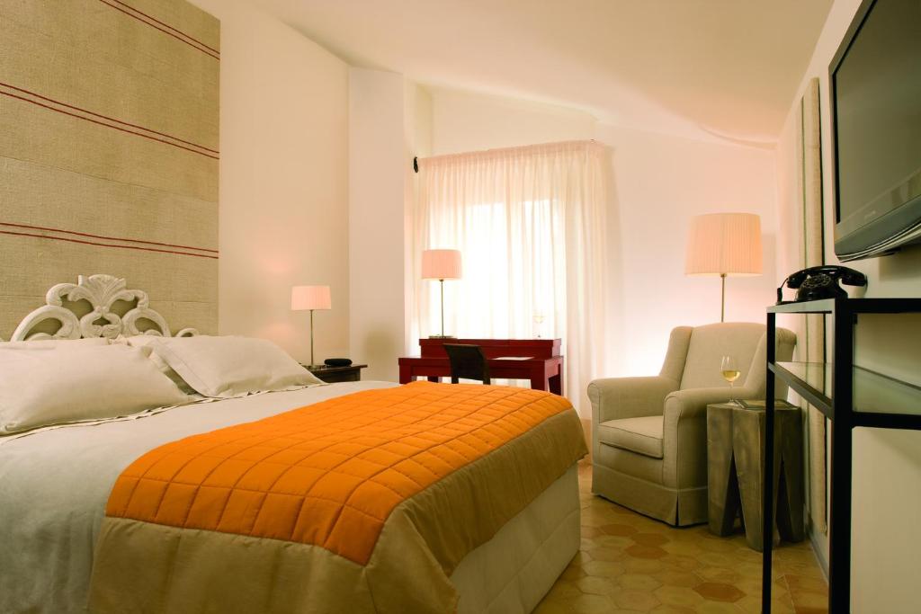 Postel nebo postele na pokoji v ubytování Relais & Chateaux Palazzo Seneca