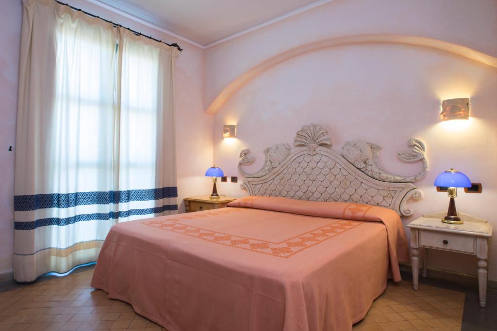 Кровать или кровати в номере Hotel Poseidonia