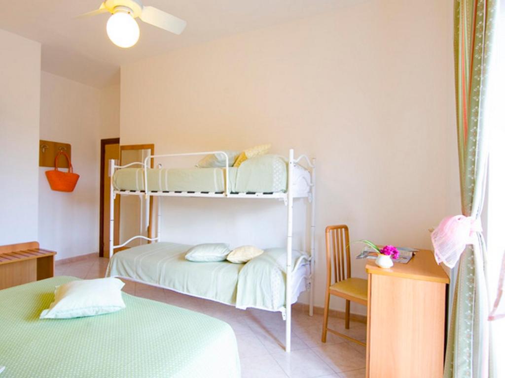 Postel nebo postele na pokoji v ubytování Hotel Villa Franz