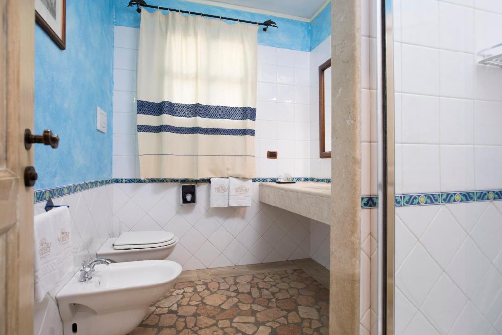 Ванная комната в Hotel Poseidonia