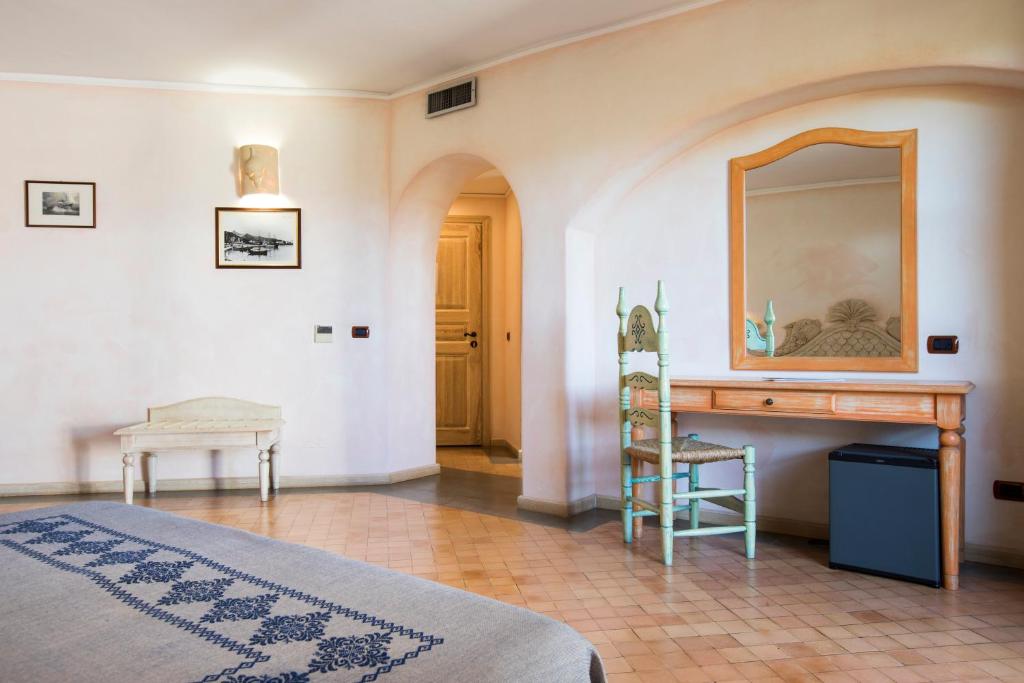 Кровать или кровати в номере Hotel Poseidonia