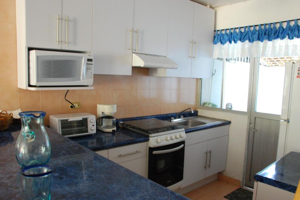 Kuchyň nebo kuchyňský kout v ubytování Casa Romantica De Playa
