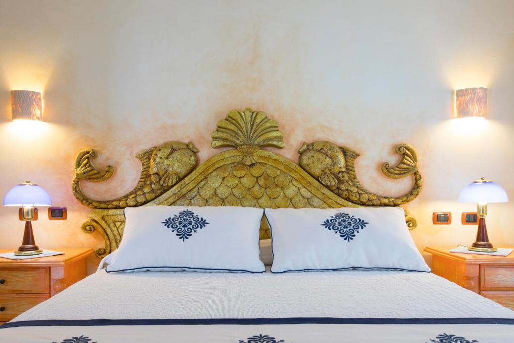 Кровать или кровати в номере Hotel Poseidonia