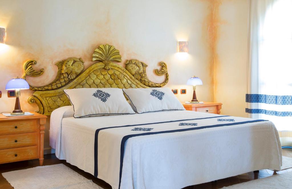 Кровать или кровати в номере Hotel Poseidonia